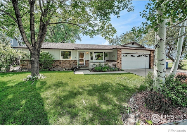 1702 Kennedy Ave, Loveland, CO 80538 - ranch-style house featuring brick siding, a garage, driveway, and a front lawn