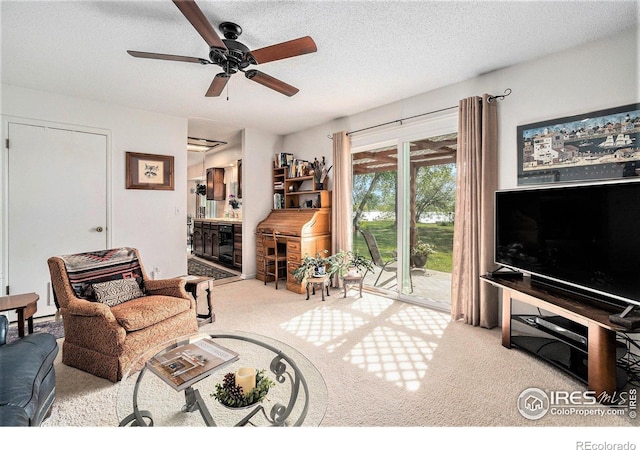 1702 Kennedy Ave, Loveland, CO 80538 - carpeted living area featuring ceiling fan and a textured ceiling