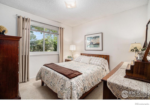 1702 Kennedy Ave, Loveland, CO 80538 - bedroom featuring carpet, a textured ceiling, and baseboards