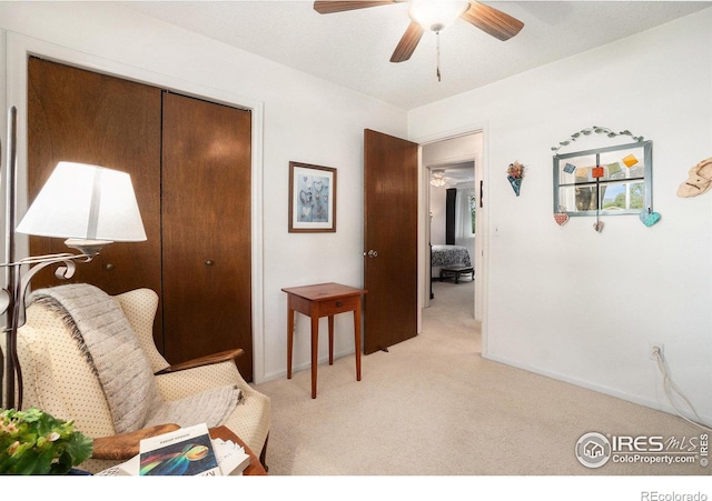 1702 Kennedy Ave, Loveland, CO 80538 - sitting room featuring light colored carpet, a ceiling fan, and baseboards