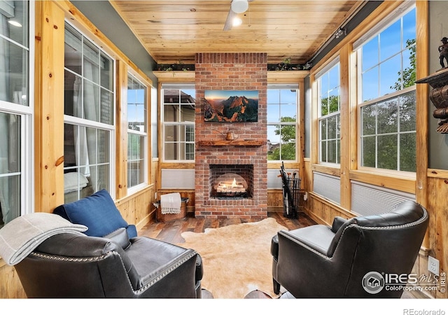 2038 Vineyard Dr, Windsor, CO 80550 - sunroom with hardwood / wood-style floors, wood ceiling, wood walls, and baseboards