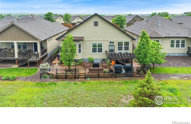 2038 Vineyard Dr, Windsor, CO 80550 - back of house with stairs, a patio, stucco siding, and a residential view