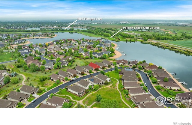 2038 Vineyard Dr, Windsor, CO 80550 - aerial view of property and surrounding area with nearby suburban area and a large body of water