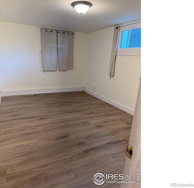 515 Cowan St, Fort Collins, CO 80524 - spare room featuring baseboards and wood finished floors