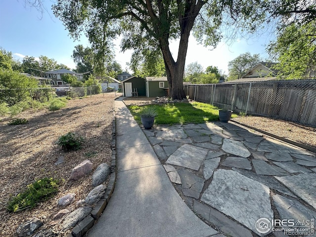515 Cowan St, Fort Collins, CO 80524 - fenced backyard featuring a patio area and an outdoor structure