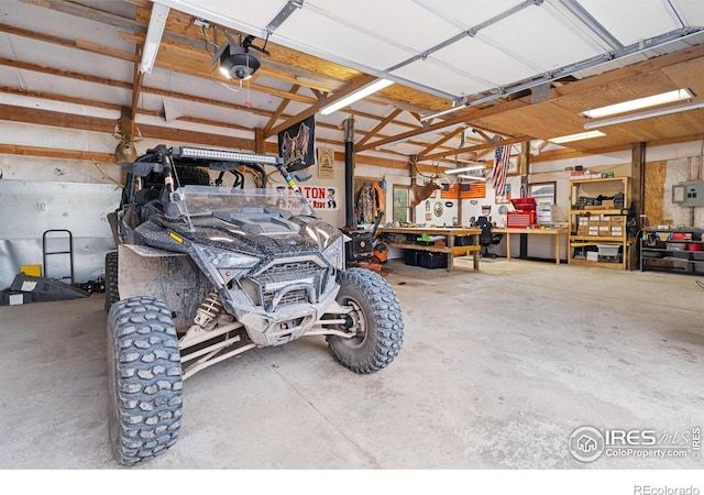36091 Appy Rd, Eaton, CO 80615 - garage with a workshop area and a garage door opener