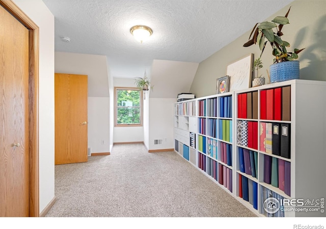 36091 Appy Rd, Eaton, CO 80615 - carpeted bedroom with a textured ceiling, baseboards, and lofted ceiling
