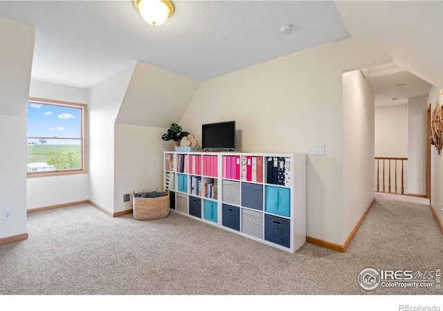 36091 Appy Rd, Eaton, CO 80615 - rec room featuring carpet, baseboards, and vaulted ceiling