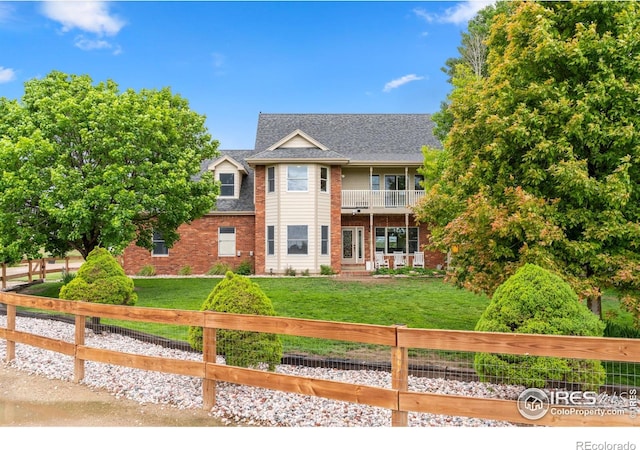 36091 Appy Rd, Eaton, CO 80615 - rear view of property with a balcony, brick siding, and roof with shingles