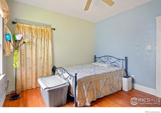 1805 8th St, Greeley, CO 80631 - bedroom with wood finished floors and ceiling fan