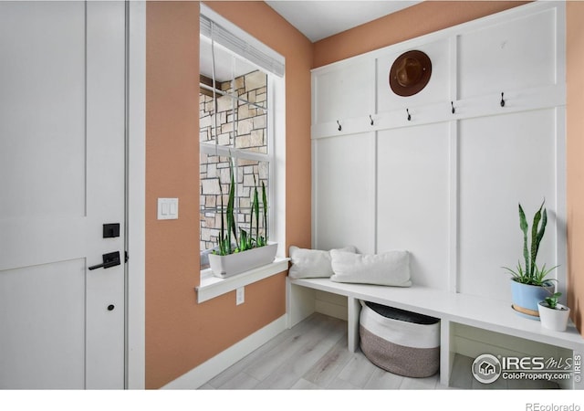 1922 Naturita St, Loveland, CO 80538 - mudroom featuring baseboards and light wood-style floors