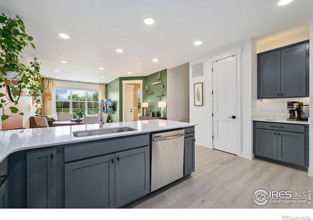 1922 Naturita St, Loveland, CO 80538 - kitchen featuring dishwasher, a sink, light wood finished floors, light countertops, and recessed lighting