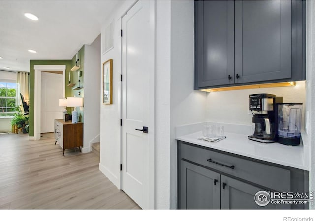 1922 Naturita St, Loveland, CO 80538 - kitchen featuring light wood-style flooring, gray cabinets, recessed lighting, baseboards, and light countertops