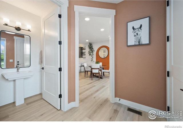 1922 Naturita St, Loveland, CO 80538 - corridor with light wood-style floors, baseboards, and recessed lighting