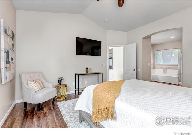 5111 Mt St Vrain Ave, Frederick, CO 80504 - bedroom with arched walkways, wood finished floors, lofted ceiling, baseboards, and ensuite bathroom