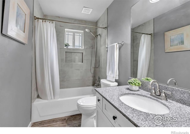 5111 Mt St Vrain Ave, Frederick, CO 80504 - full bathroom with shower / bath combination with curtain, vanity, and toilet