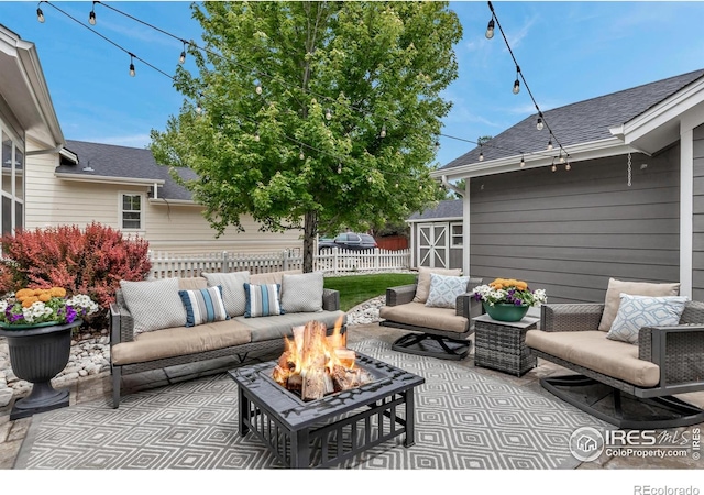 5111 Mt St Vrain Ave, Frederick, CO 80504 - view of patio / terrace with an outdoor living space with a fire pit