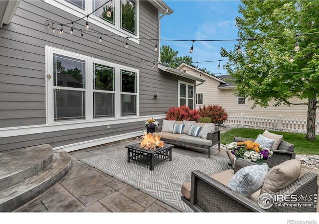 5111 Mt St Vrain Ave, Frederick, CO 80504 - view of patio / terrace with an outdoor living space with a fire pit