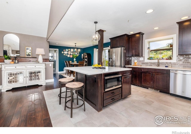 4721 Arthur Mae Ln, Laporte, CO 80535 - kitchen with stainless steel appliances, plenty of natural light, decorative backsplash, and recessed lighting