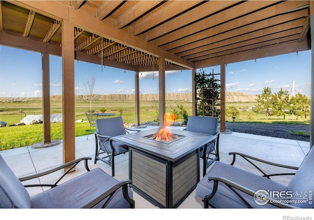 4721 Arthur Mae Ln, Laporte, CO 80535 - view of patio / terrace featuring a fire pit and a rural view