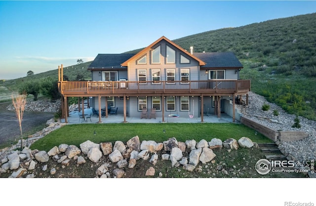 4721 Arthur Mae Ln, Laporte, CO 80535 - back of property featuring a patio, a deck, and a yard