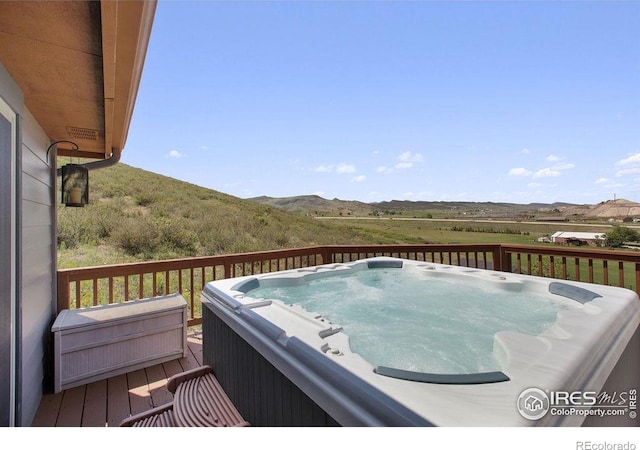 4721 Arthur Mae Ln, Laporte, CO 80535 - deck featuring a hot tub and a mountain view