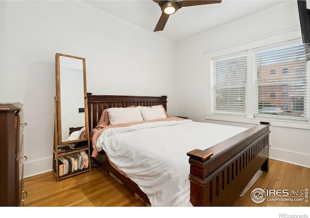 701 Mathews St, Fort Collins, CO 80524 - bedroom with wood finished floors, crown molding, baseboards, and a ceiling fan