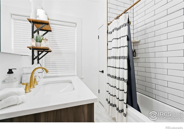701 Mathews St, Fort Collins, CO 80524 - bathroom with vanity, shower / bath combo with shower curtain, and marble finish floors