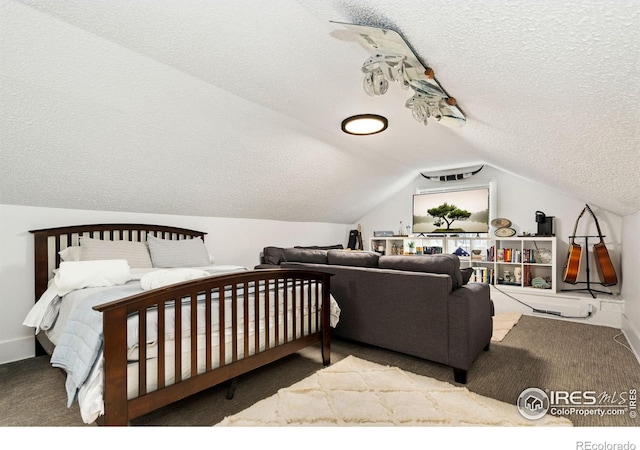 701 Mathews St, Fort Collins, CO 80524 - carpeted bedroom featuring a textured ceiling, lofted ceiling, and baseboards