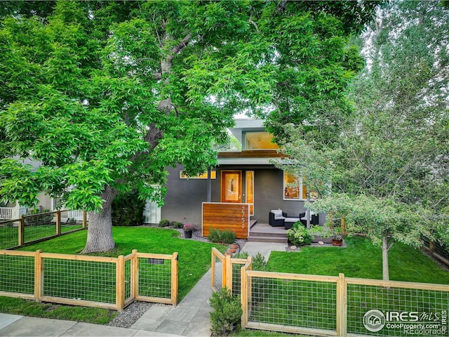 2750 7th St, Boulder, CO 80304 - view of property hidden behind natural elements with outdoor lounge area and stucco siding