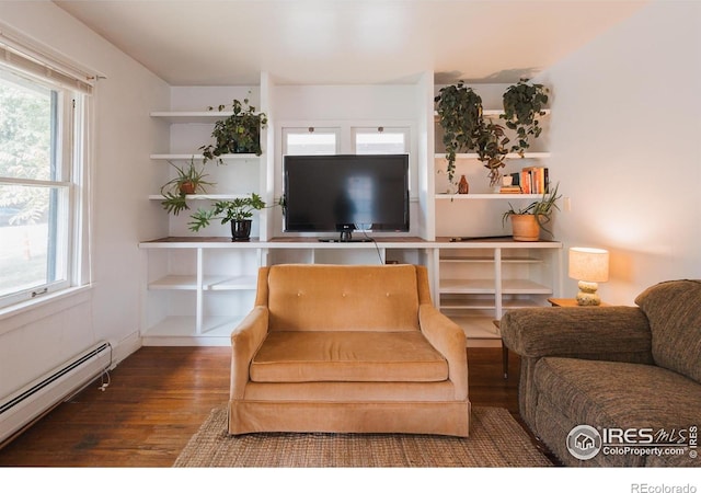 416 E Elizabeth St, Fort Collins, CO 80524 - living room with baseboard heating, wood finished floors, and plenty of natural light