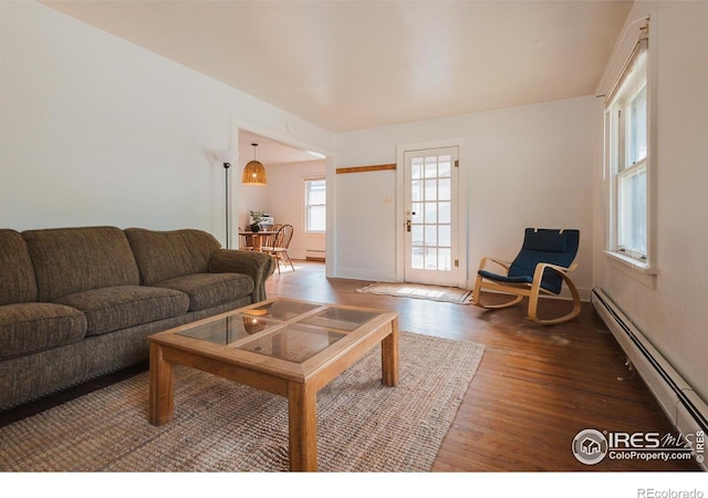 416 E Elizabeth St, Fort Collins, CO 80524 - living room featuring a baseboard radiator, wood finished floors, and baseboard heating