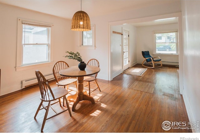 416 E Elizabeth St, Fort Collins, CO 80524 - dining room featuring wood finished floors, plenty of natural light, and baseboards
