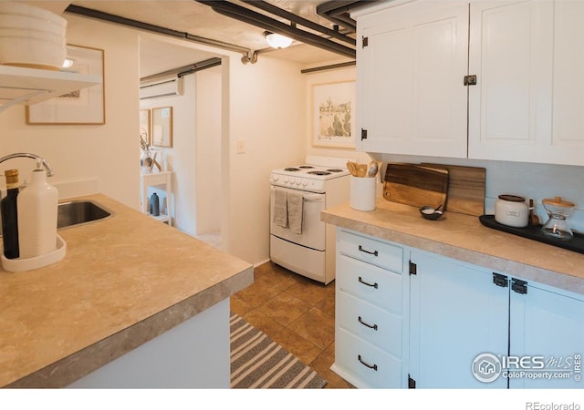 416 E Elizabeth St, Fort Collins, CO 80524 - kitchen featuring white electric stove, white cabinets, blue cabinetry, light countertops, and tile patterned floors
