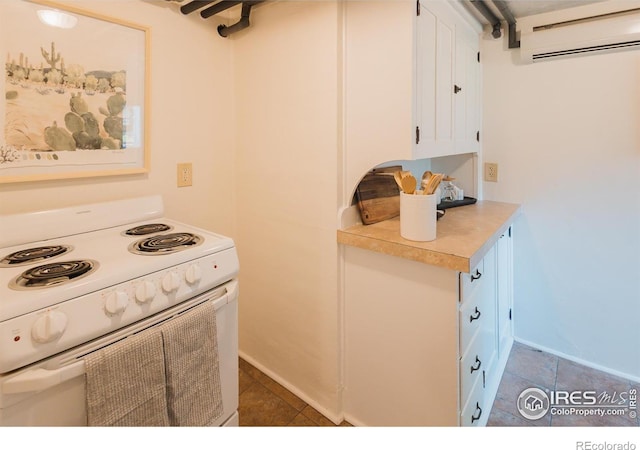 416 E Elizabeth St, Fort Collins, CO 80524 - kitchen with white electric range oven, a wall mounted air conditioner, light countertops, tile patterned flooring, and white cabinets