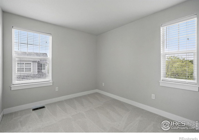 518 Hoyt Ln, Lafayette, CO 80026 - carpeted empty room with plenty of natural light and baseboards