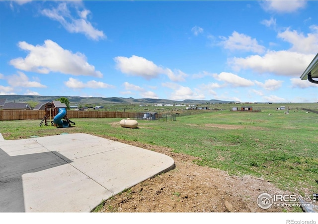 2836 W County Road 60e, Fort Collins, CO 80524 - view of yard featuring a playground and a patio area