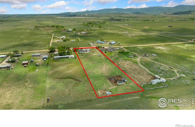 2836 W County Road 60e, Fort Collins, CO 80524 - aerial view of sparsely populated area with mountains and property parcel outlined