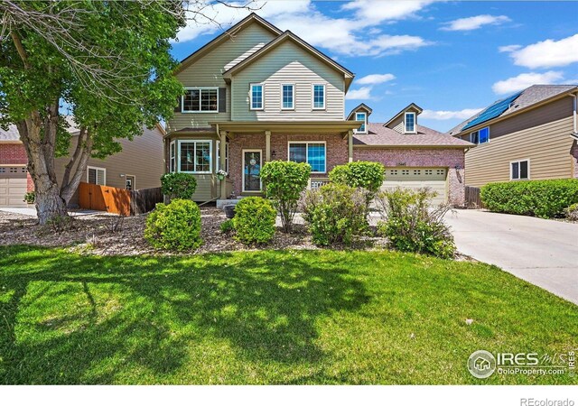 13445 Kearney St, Thornton, CO 80602 - traditional-style home featuring brick siding, concrete driveway, and an attached garage