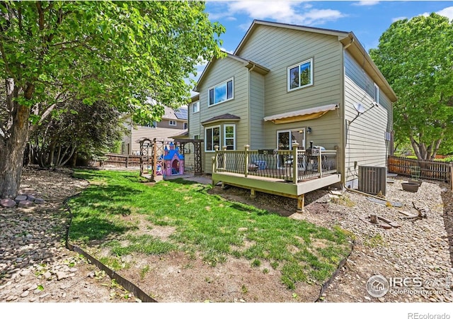 13445 Kearney St, Thornton, CO 80602 - rear view of property featuring a wooden deck and a playground