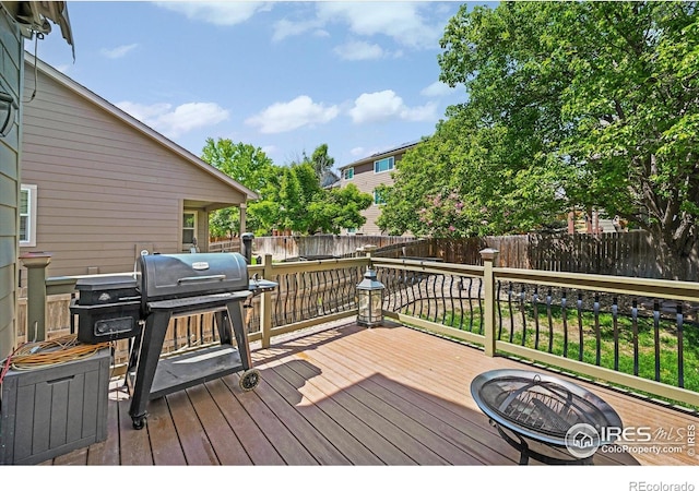13445 Kearney St, Thornton, CO 80602 - wooden terrace featuring a fenced backyard