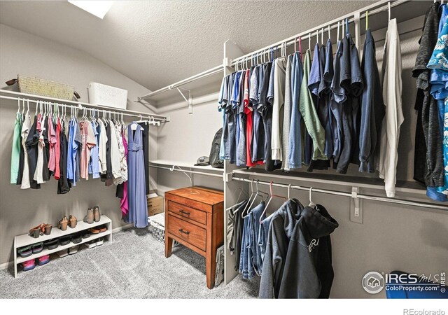 13445 Kearney St, Thornton, CO 80602 - walk in closet featuring vaulted ceiling and carpet flooring