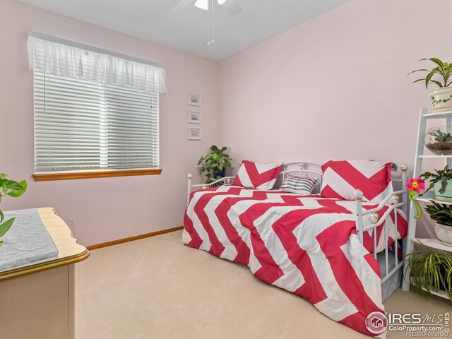 1536 Goshawk Dr, Longmont, CO 80504 - carpeted bedroom with baseboards and ceiling fan