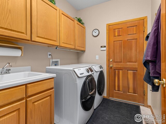 1536 Goshawk Dr, Longmont, CO 80504 - laundry room with cabinet space and washing machine and dryer