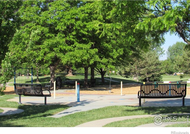 1536 Goshawk Dr, Longmont, CO 80504 - view of community featuring a lawn and view of scattered trees