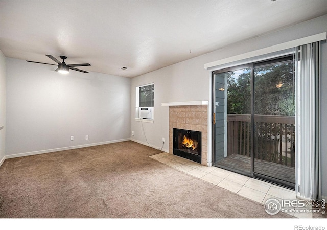 225 E 8th Ave Unit C-19, Longmont, CO 80504 - unfurnished living room featuring carpet, healthy amount of natural light, ceiling fan, and a tiled fireplace