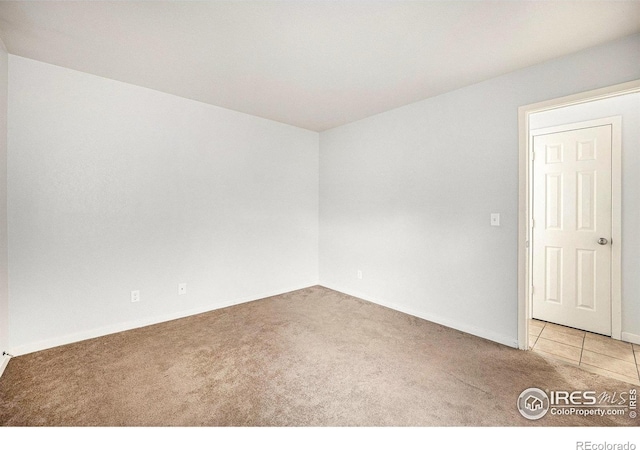 225 E 8th Ave Unit C-19, Longmont, CO 80504 - unfurnished room featuring carpet flooring and baseboards