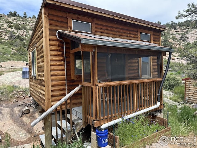 2302 W County Road 82e, Livermore, CO 80536 - back of house featuring a sunroom