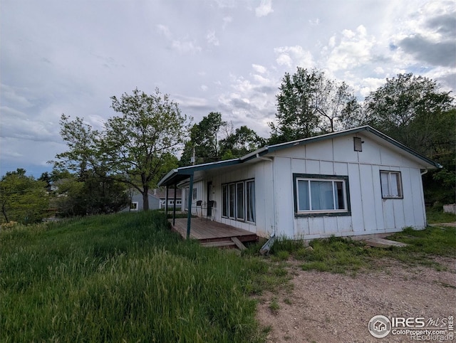 4809 Foothills Dr, Fort Collins, CO 80526 - view of side of property featuring board and batten siding and a wooden deck