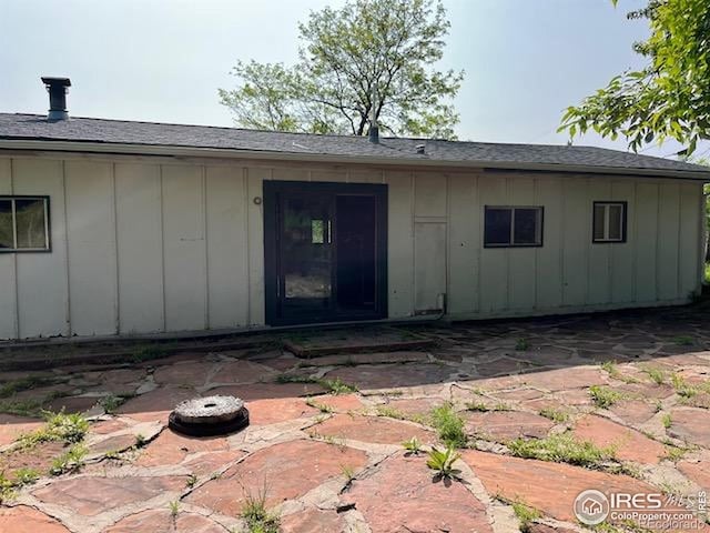 4809 Foothills Dr, Fort Collins, CO 80526 - back of house with board and batten siding and a patio